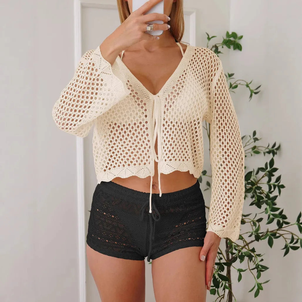 Women's hollow woven cardigan blouse with bell sleeves in apricot colour showing short 40cm length