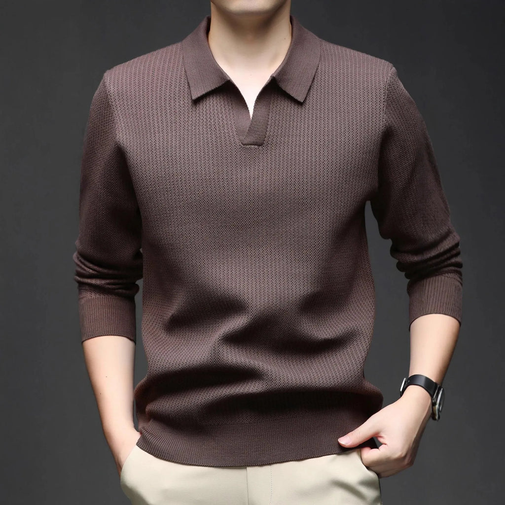 Men's loose fit casual green pullover sweater for autumn layering on a hanger.