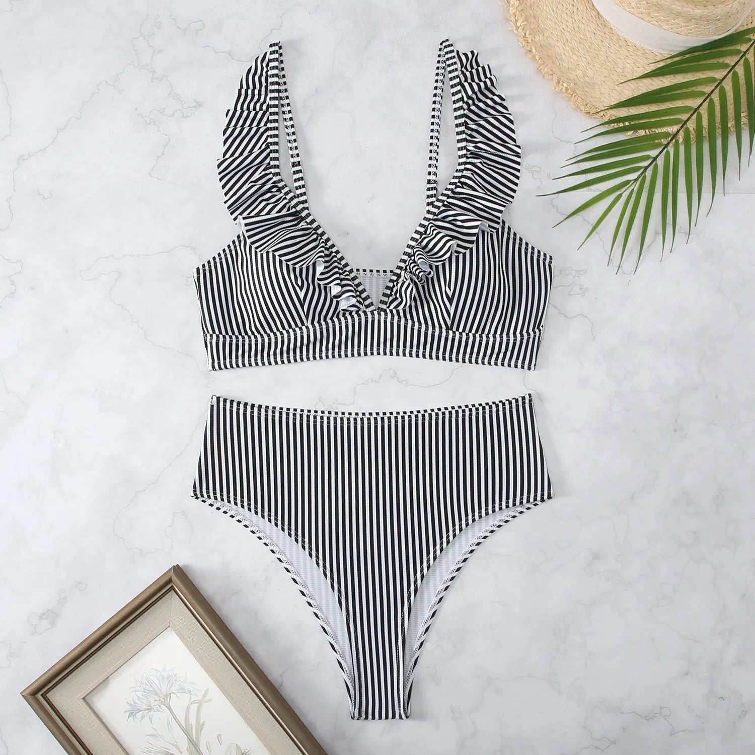 Retro striped split bikini swimsuit in black and white stripes on mannequin