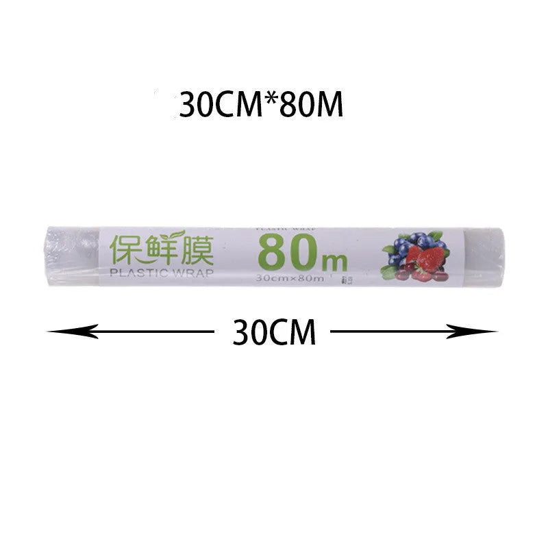 White and blue magnetic cling film cutter hanging on a fridge with a film roll