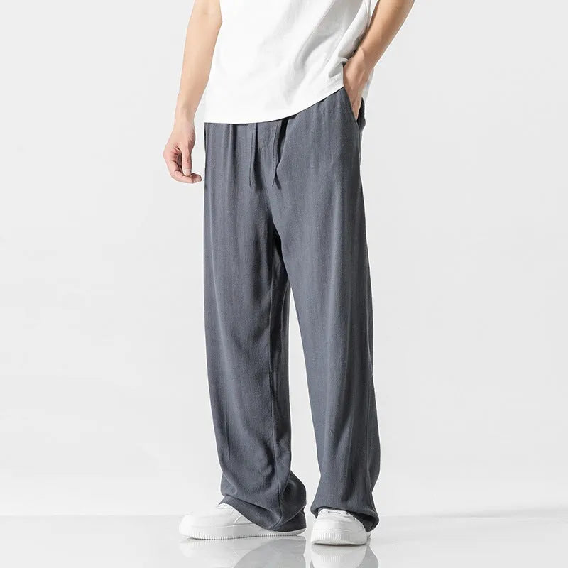 Men's straight-leg casual trousers in beige bamboo fibre fabric with a drawstring waist.