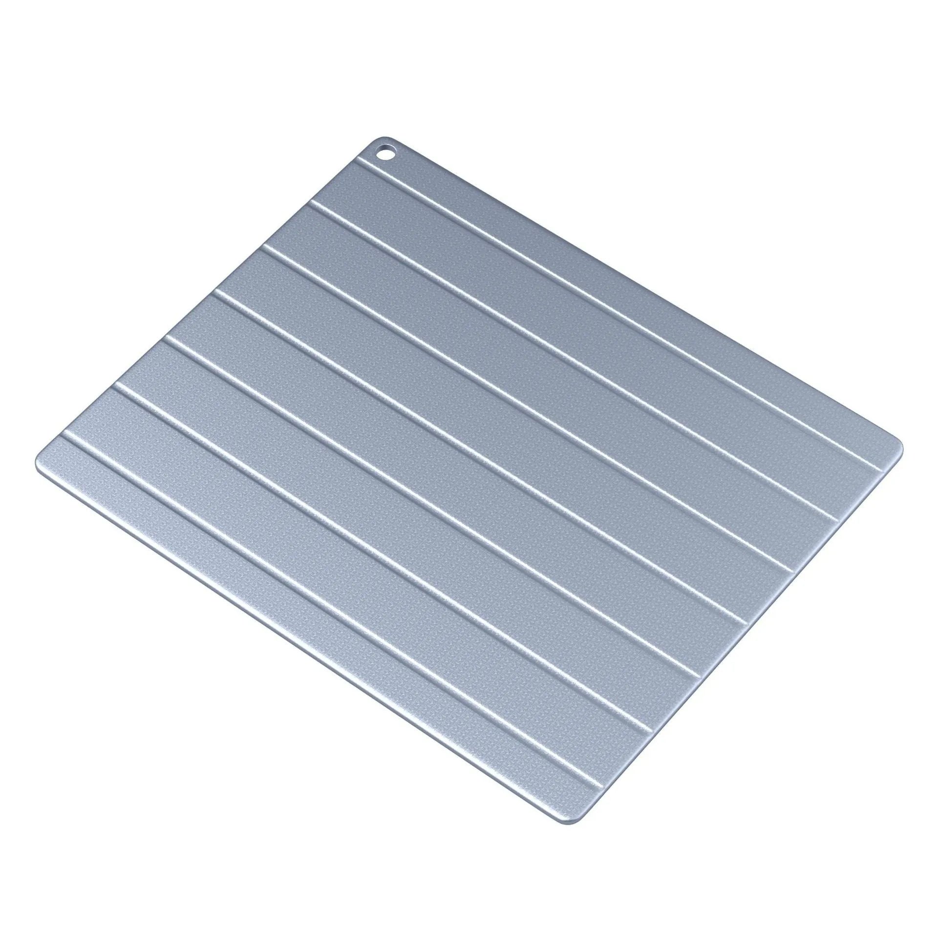 Aluminium quick defrosting plate for food on a kitchen worktop.