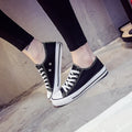 Women's solid colour canvas casual shoes shown in black, white black, white red, and all black options.