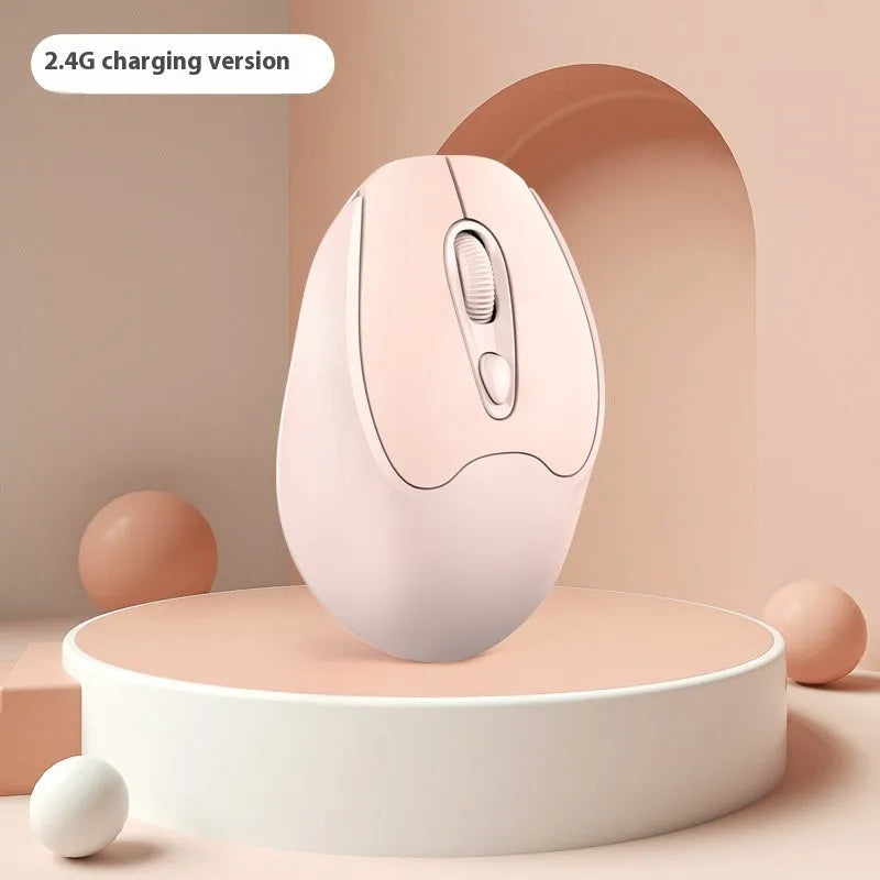 Bluetooth wireless mouse in choice of girl pink, milk tea pink, grey or green colours on a desk next to a laptop.