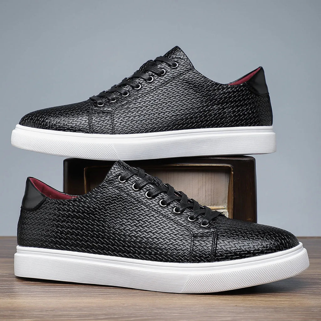 Men's black low-top leather business shoes with stitched detailing and a rubber sole.