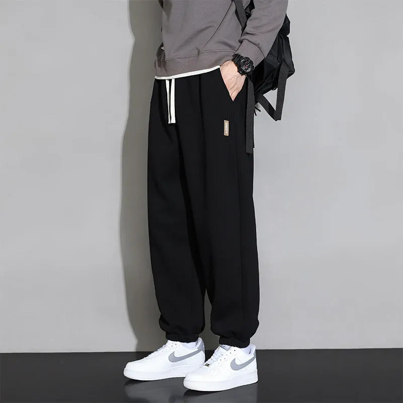 Men's loose fit sports trousers in grey colour with elastic waistband and drawstring closure