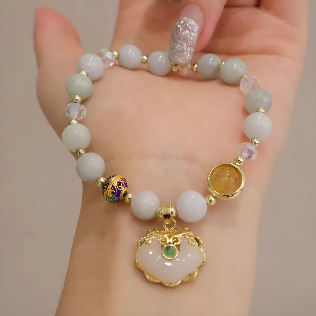 Women's geometric bracelet in choice of gray jade or strawberry quartz with ethnic metal decorations