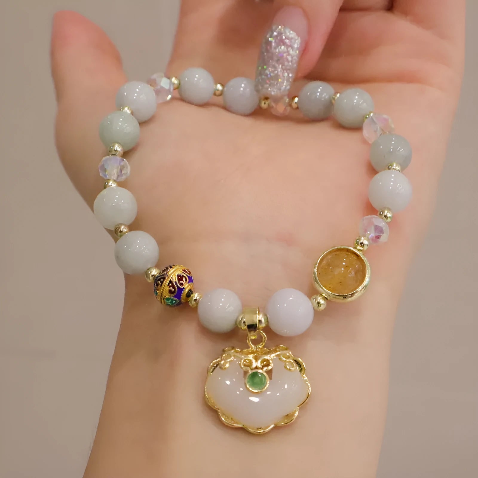 Women's geometric bracelet in choice of gray jade or strawberry quartz with ethnic metal decorations