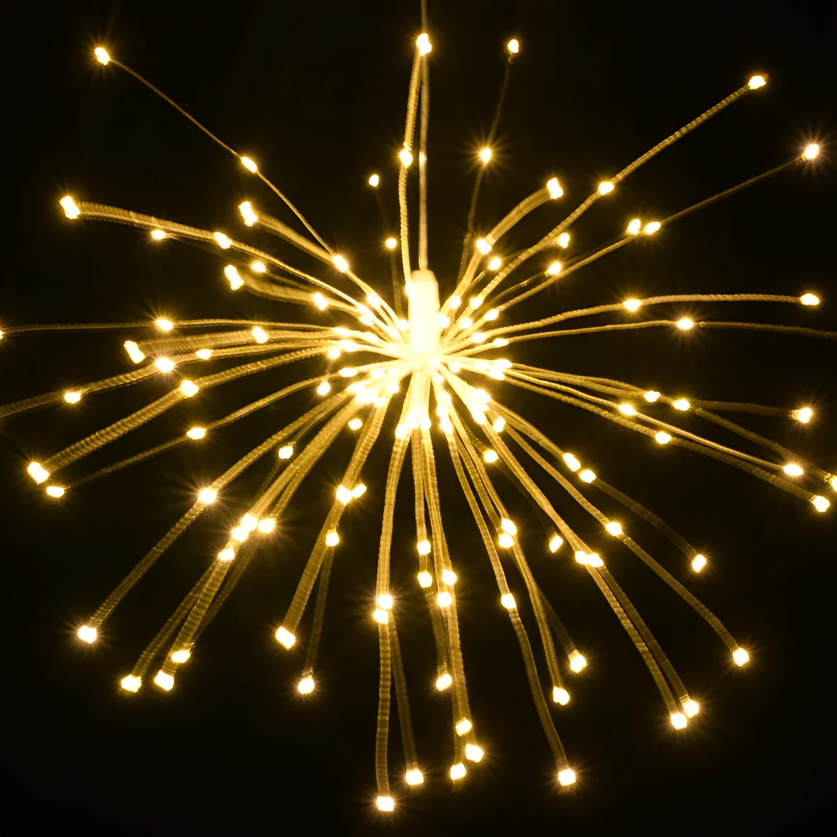 Outdoor waterproof dandelion string lights with warm colour glow on a garden fence