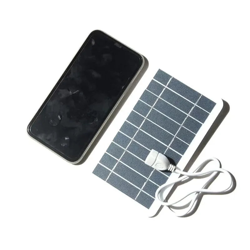 Compact 157x94mm PET solar panel charger with USB cable for device charging