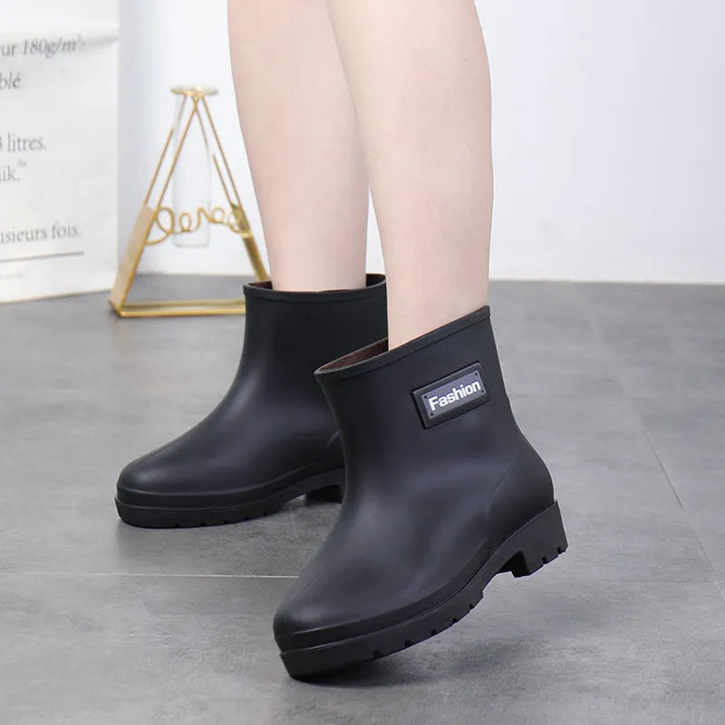 Women's mid-calf PVC rain boots in apricot colour with a low heel for wet weather.