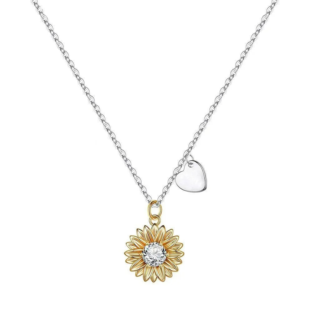 Sunflower and daisy sterling silver pendant on an adjustable cross chain necklace.