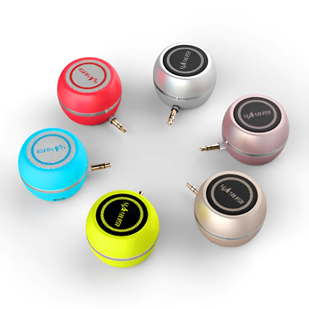 A5 portable mini speaker in red with 3.5mm audio plug and ABS plastic casing on a table