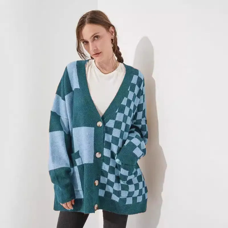 Loose fit knitwear cardigan with checks print in a selection of colours on a hanger.