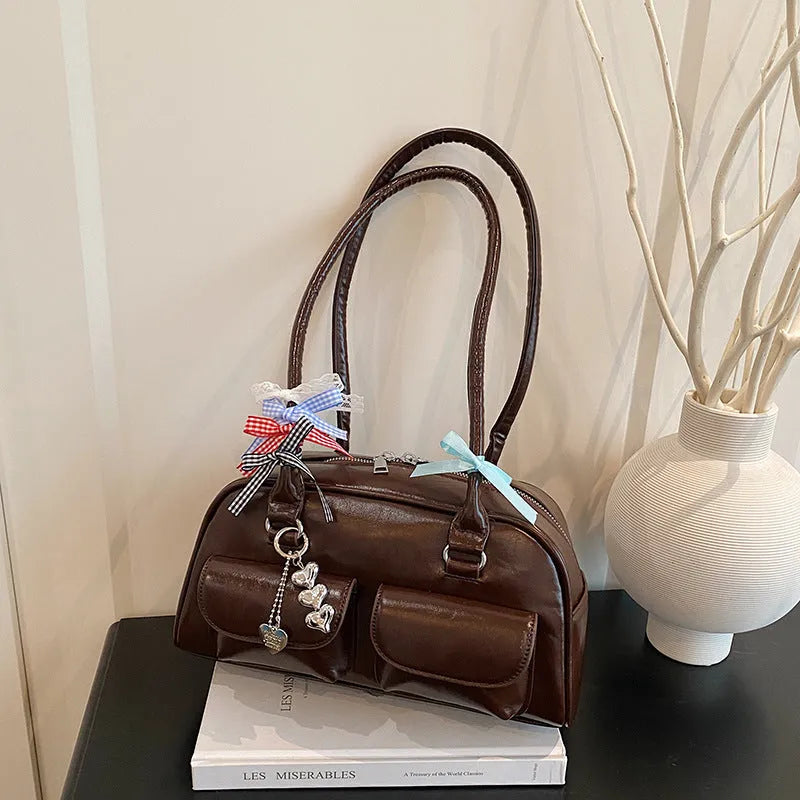 Women's black PU leather pillow shoulder bag with retro one-shoulder design and double straps