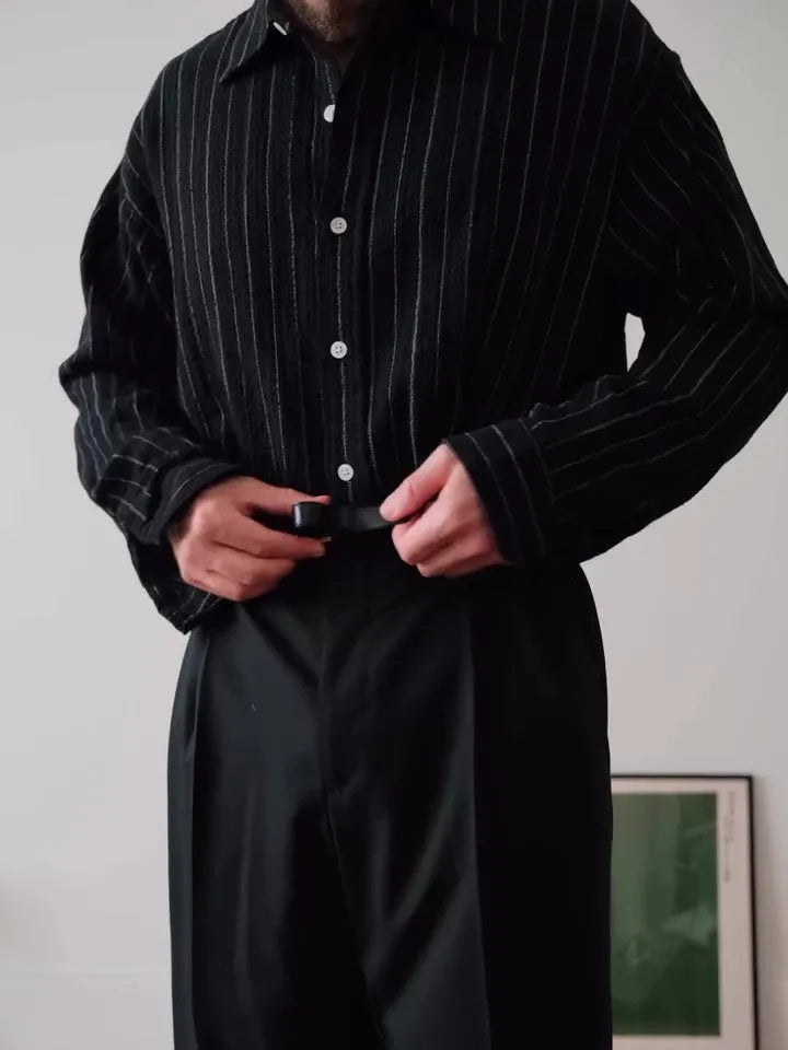 Men's black pinstriped button-down shirt showing regular fit and traditional button-down collar