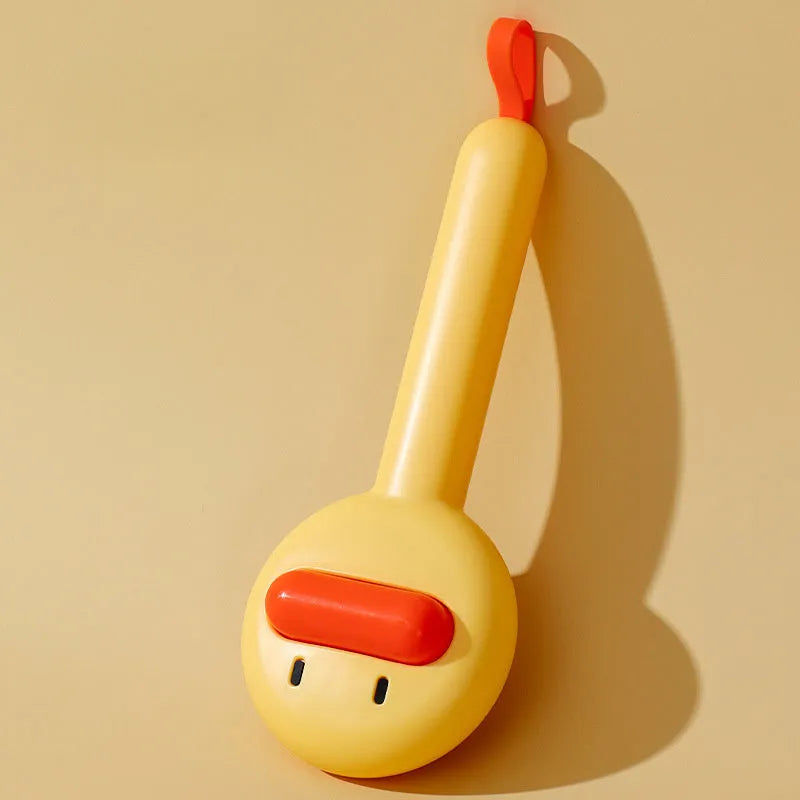 Small yellow duck-shaped pet grooming comb with open-section needle brush design for cat and dog hair removal