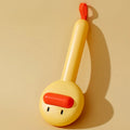 Small yellow duck-shaped pet grooming comb with open-section needle brush design for cat and dog hair removal