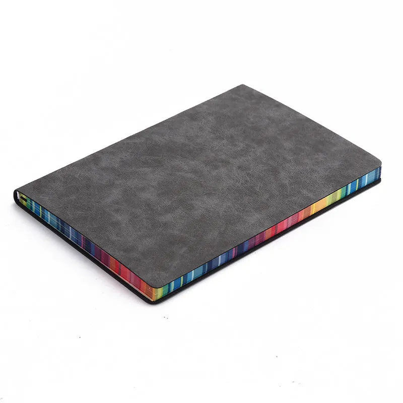 A5 rainbow side PU leather cover notebook open on a desk, showing lock line hardcover binding and 100g Daolin paper pages
