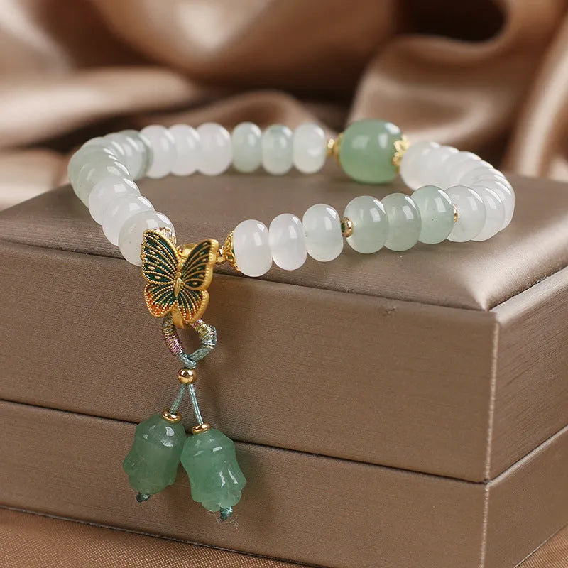 Green Tian Shan Cui abacus bead bracelet with crystal detailing and butterfly tassel