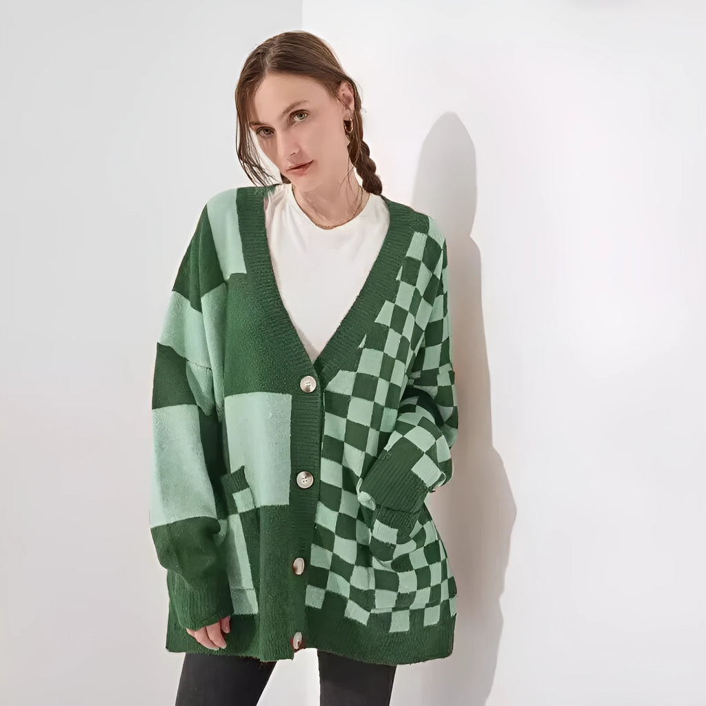 Loose fit knitwear cardigan with checks print in a selection of colours on a hanger.