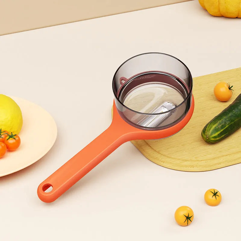 Kitchen peeler with integrated storage bucket in light green colour