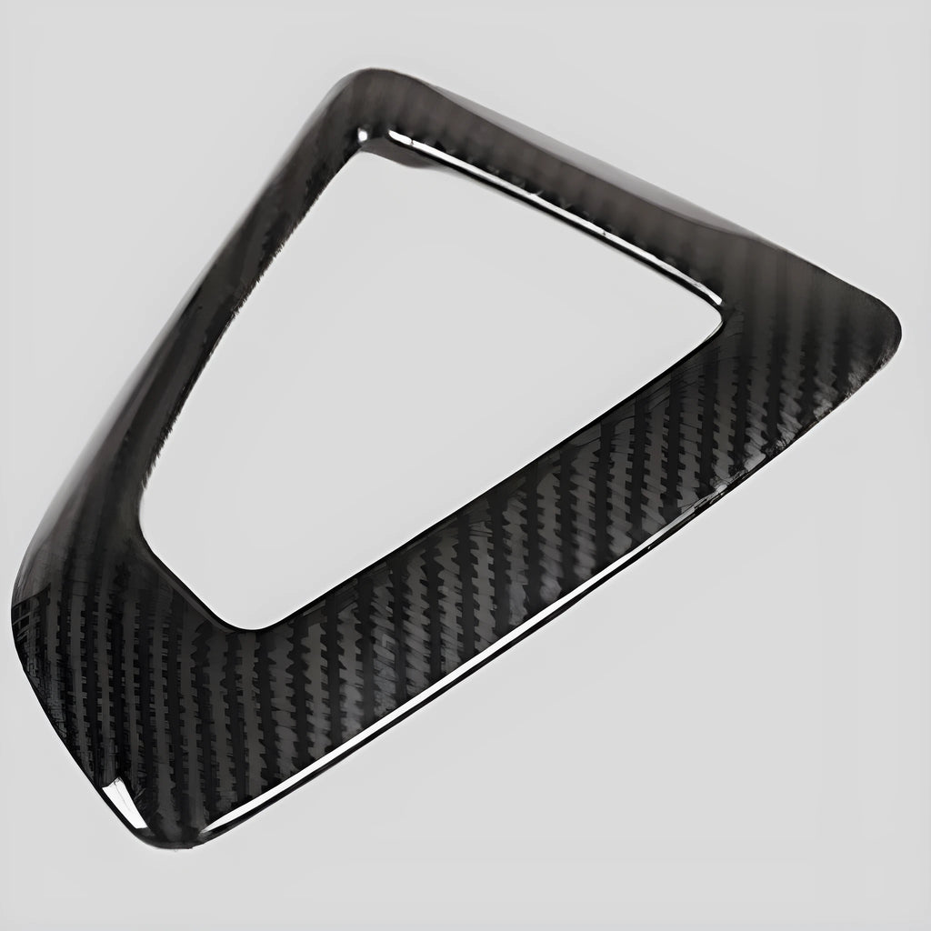 BMW gear selector base frame in carbon fibre pattern left titanium colour, showing 3M adhesive backing.