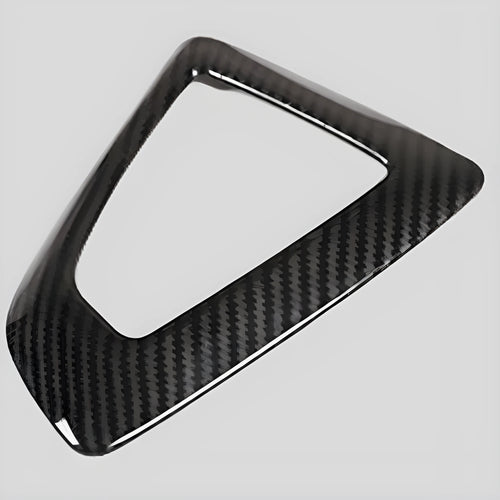 BMW gear selector base frame in carbon fibre pattern left titanium colour, showing 3M adhesive backing.