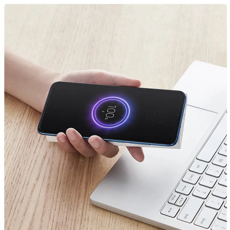 White and black 10000mAh power bank with USB-C port and wireless charging surface