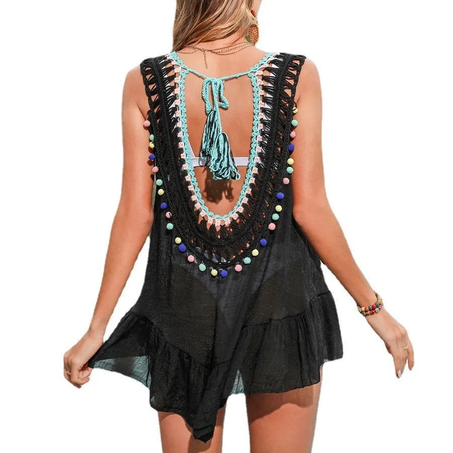 Black hand-crocheted women's beach cover-up vest with ruffles and a polyester lining.