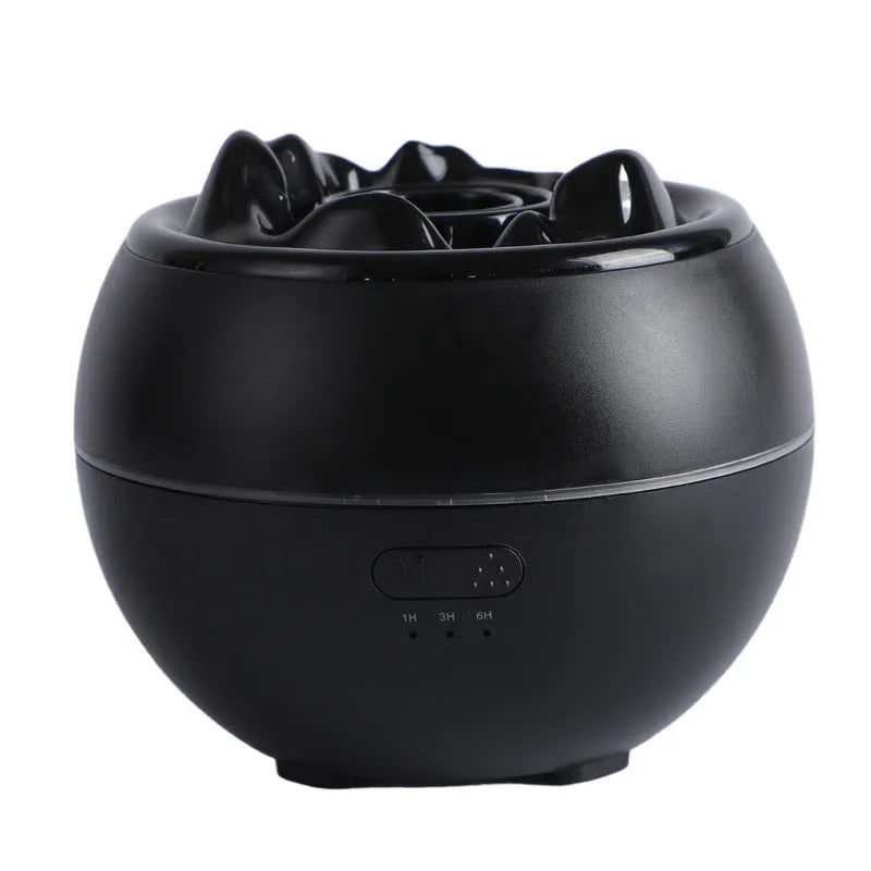 White round flame aroma diffuser humidifier with timer settings on a desk.