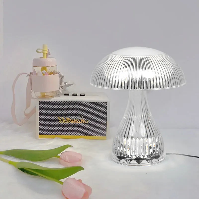 Small white rechargeable table lamp with USB cable and three colour light settings.