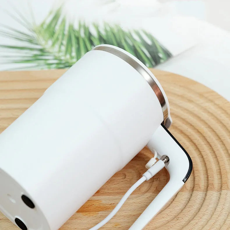 White automatic stirring coffee mug with LCD temperature display and USB charging cable