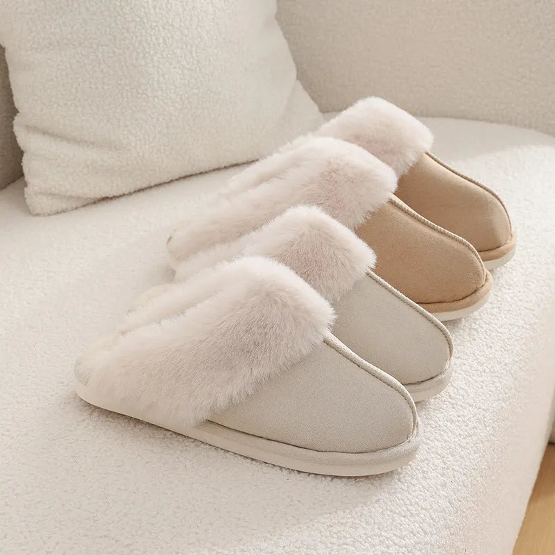 Brown plush indoor slippers with round toe, flat heel, and stitched detail on a PVC sole.