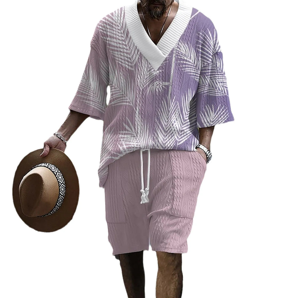 Man wearing a printed drop-shoulder knitted short-sleeve jacket with matching shorts in a casual setting.
