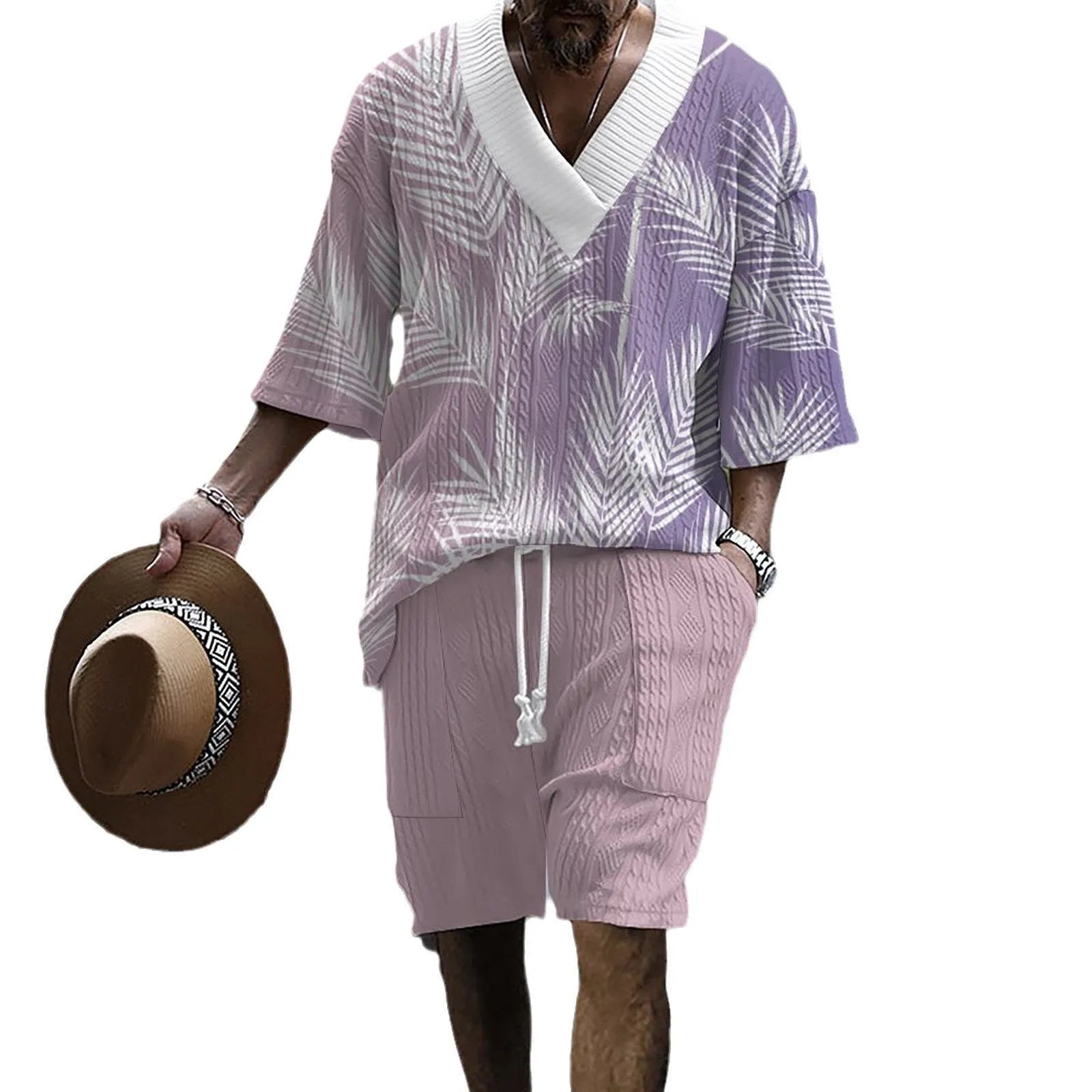 Man wearing a printed drop-shoulder knitted short-sleeve jacket with matching shorts in a casual setting.