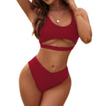 Women's high-waisted triangle bikini set in solid colour with backless design.