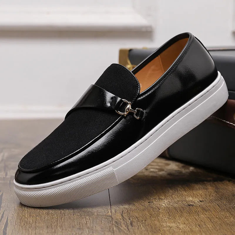 Men's black artificial leather slip-on shoes with a gold horsebit buckle and round toe on a rubber sole.