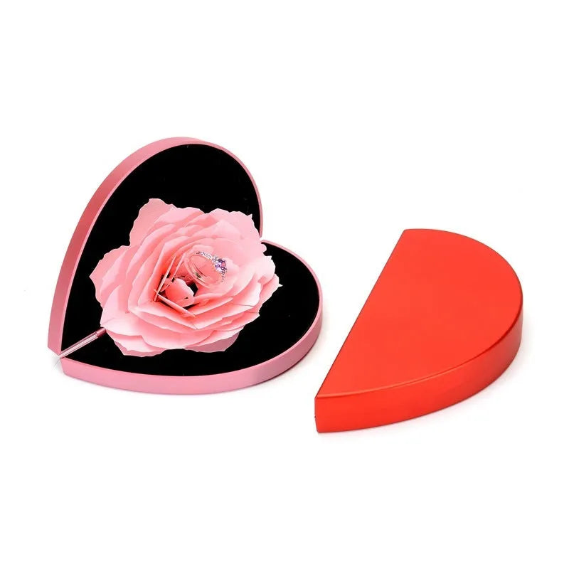 Red heart-shaped rotating ring box with 3D love motif and rose decoration for jewellery packaging