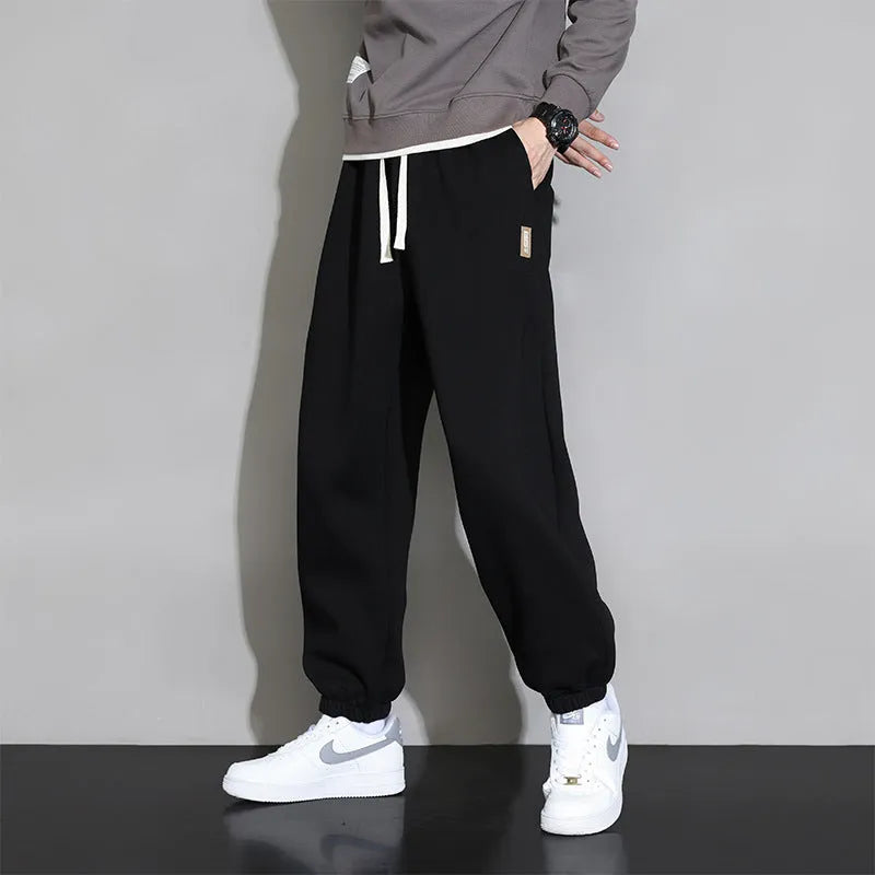 Men's loose fit sports trousers in grey colour with elastic waistband and drawstring closure