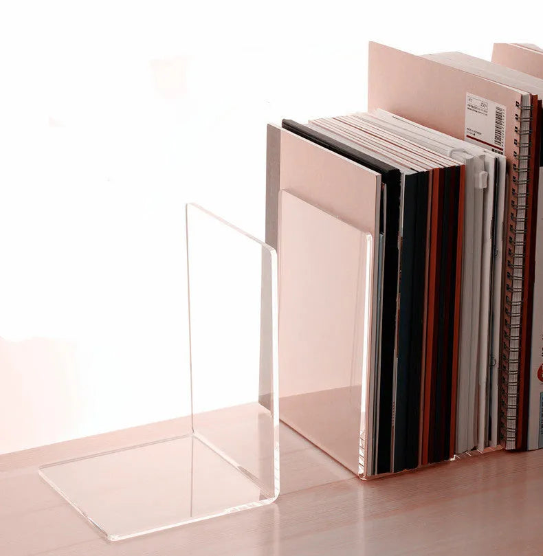 Transparent acrylic bookshelf holding two books on a desk surface