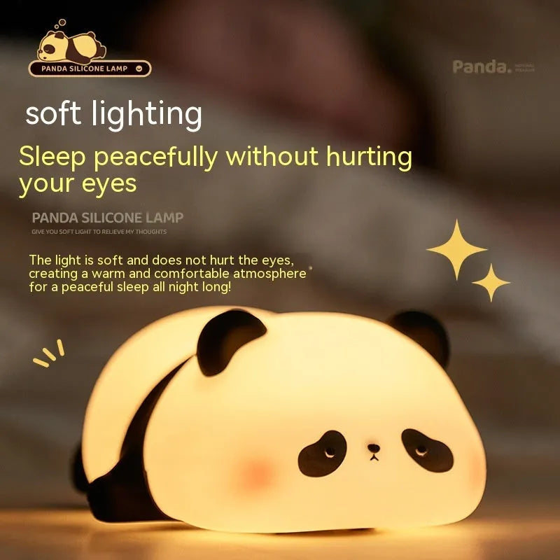 Panda-shaped silicone night light for kids on a bedside table