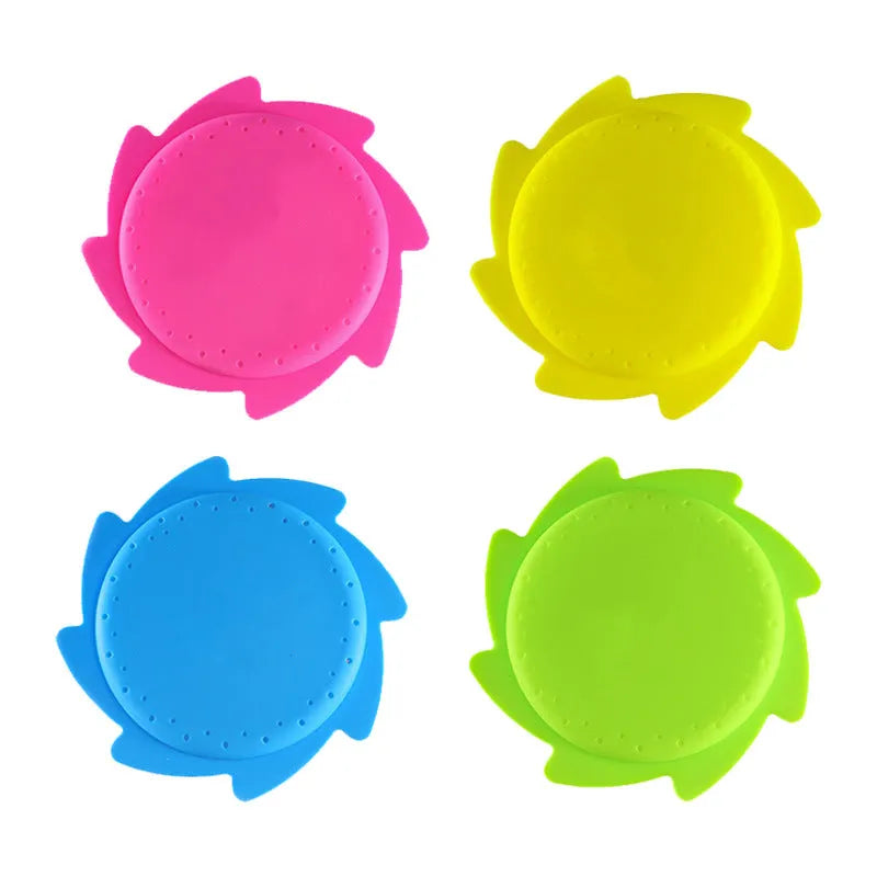 Silicone water toy in blue expression style on a wet surface for bath play