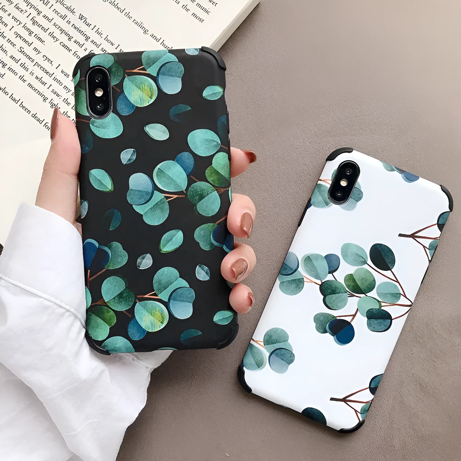 Black silicone iPhone case with leaf pattern texture and raised camera protection rim