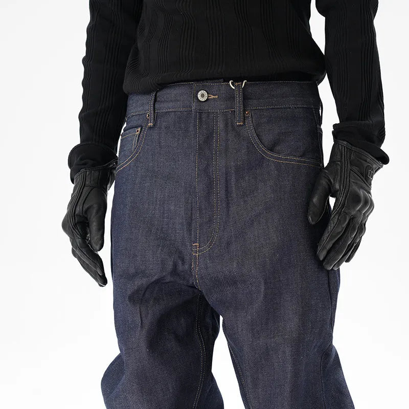 Man's dark blue loose-fit straight leg denim jeans on a neutral background.