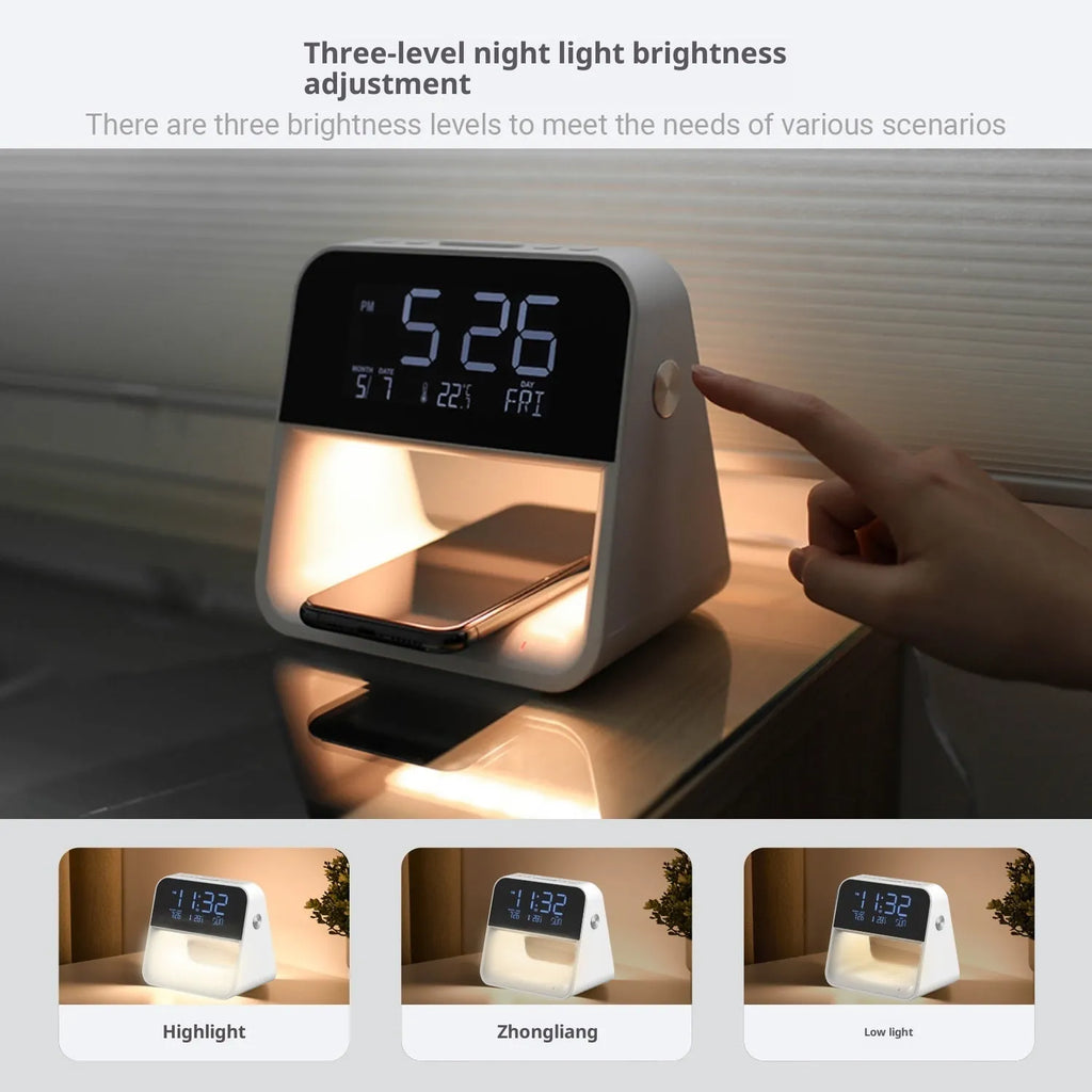 White multifunctional bedside lamp with wireless mobile phone charger and alarm clock on a nightstand