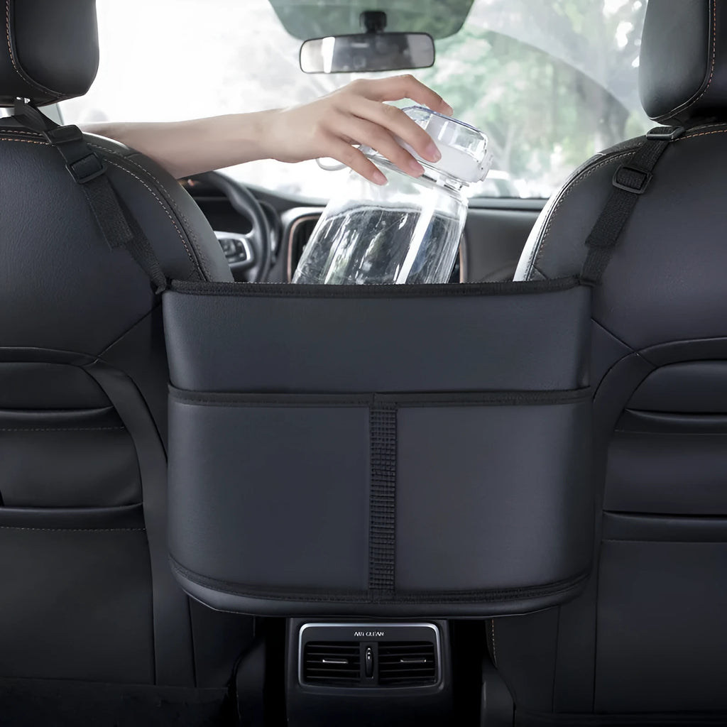 Black leather car seat net pocket storage bag with carbon fiber pattern, 38x24x15cm, placed on a car seat