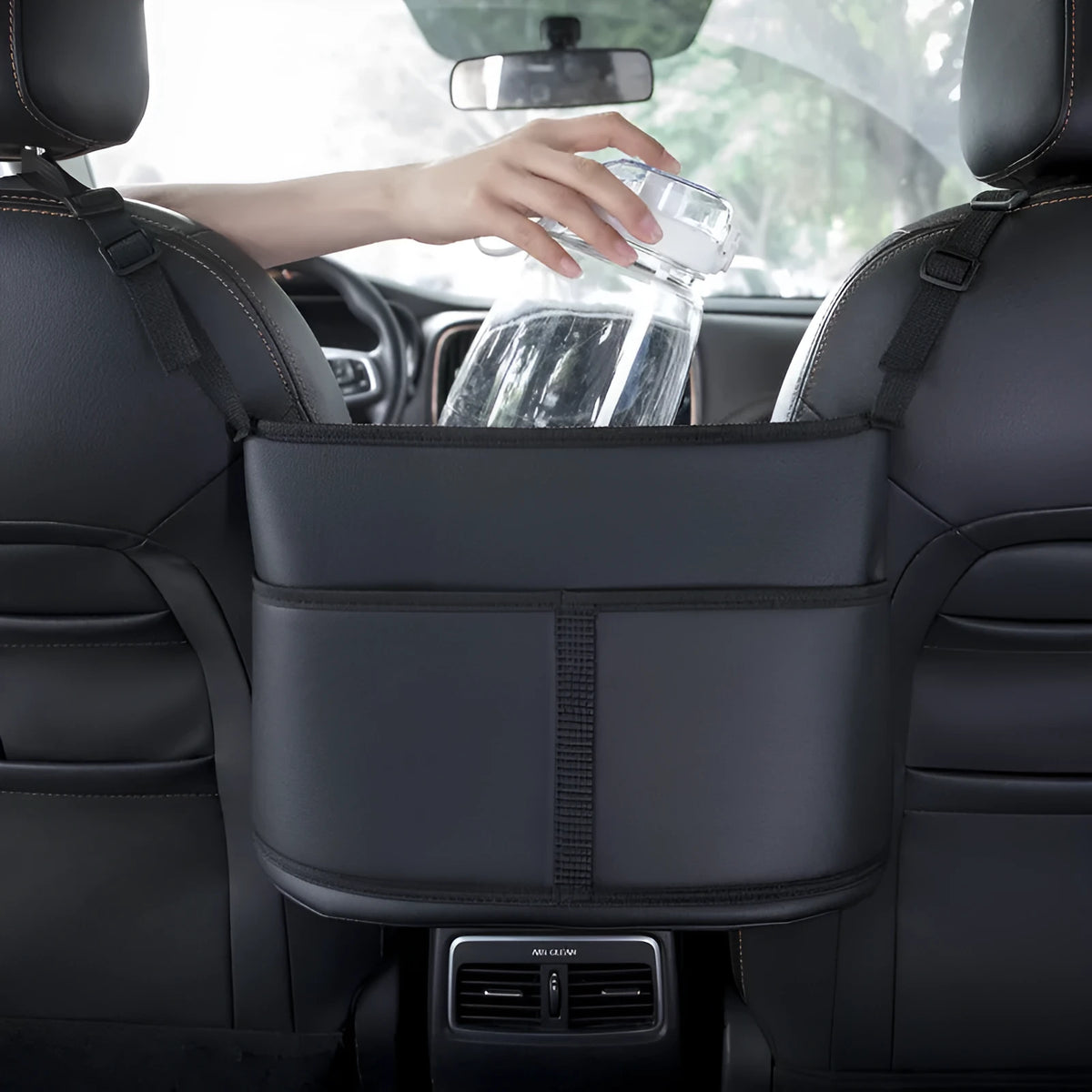 Black leather car seat net pocket storage bag with carbon fiber pattern, 38x24x15cm, placed on a car seat