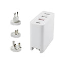 Black and white four-port USB-C wall charger with interchangeable UK, US, EU, and AU plug heads.