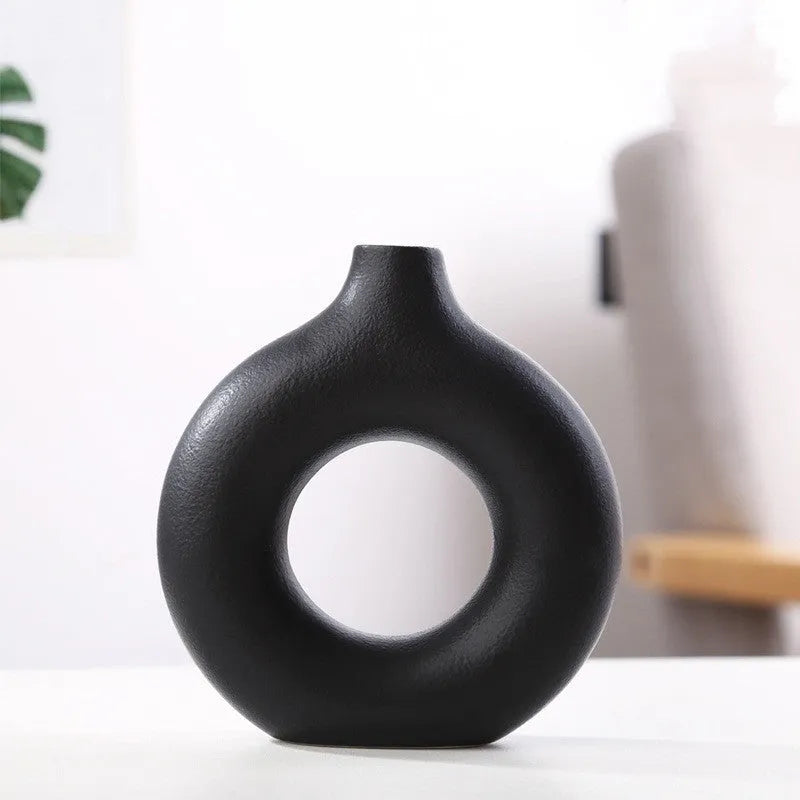 Unglazed porcelain biscuit vase with frosted particle surface in neutral colour